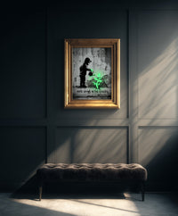 A monochromatic Banksy-style street art print of a hooded child watering a glowing neon green plant growing from a cracked wall with stenciled text reading HOPE GROWS IN THE CRACKS, created by Artazyn.