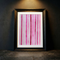 Minimalist art print featuring vertical watercolor stripes in various shades of pink and magenta on a white background, created by Artazyn.