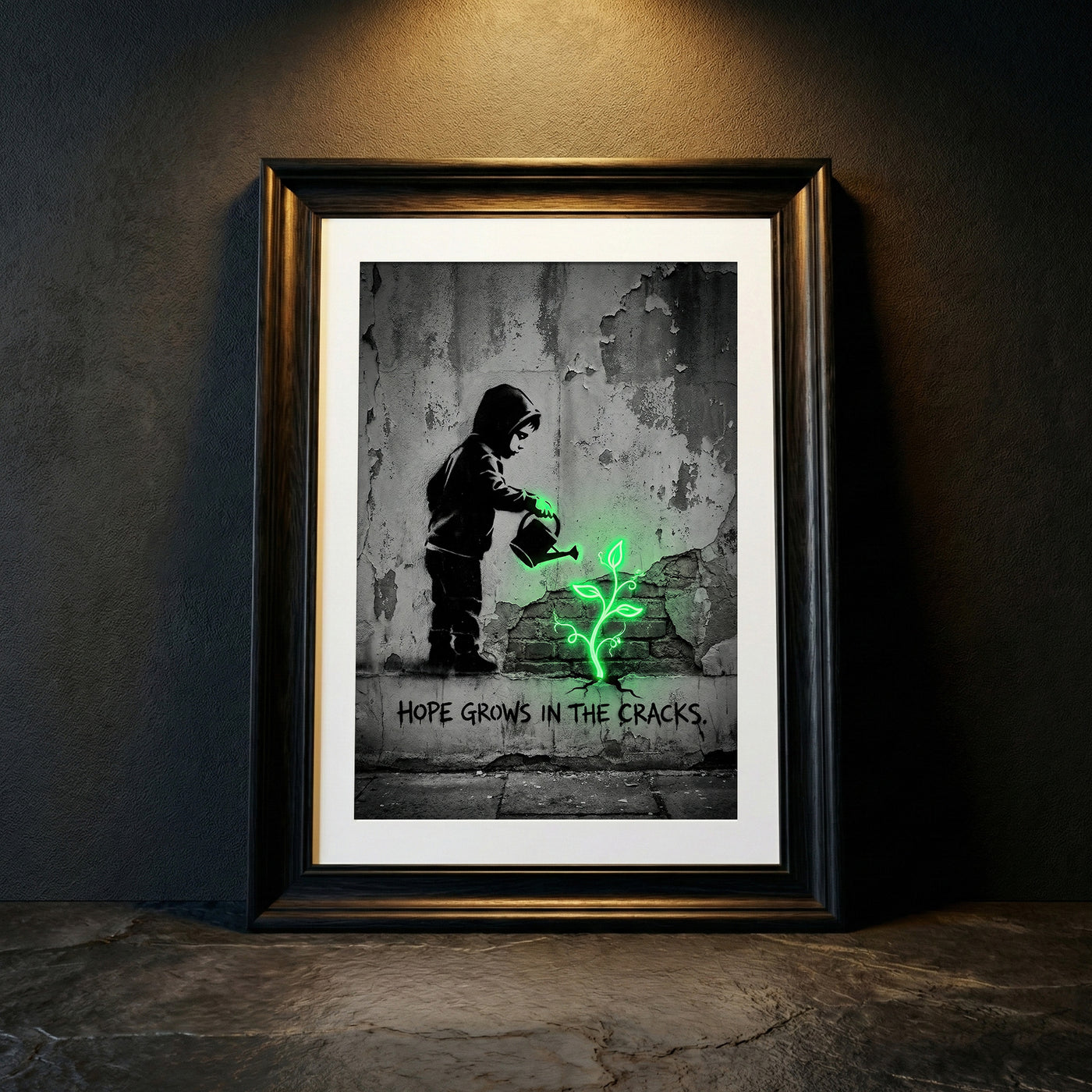 A monochromatic Banksy-style street art print of a hooded child watering a glowing neon green plant growing from a cracked wall with stenciled text reading HOPE GROWS IN THE CRACKS, created by Artazyn.