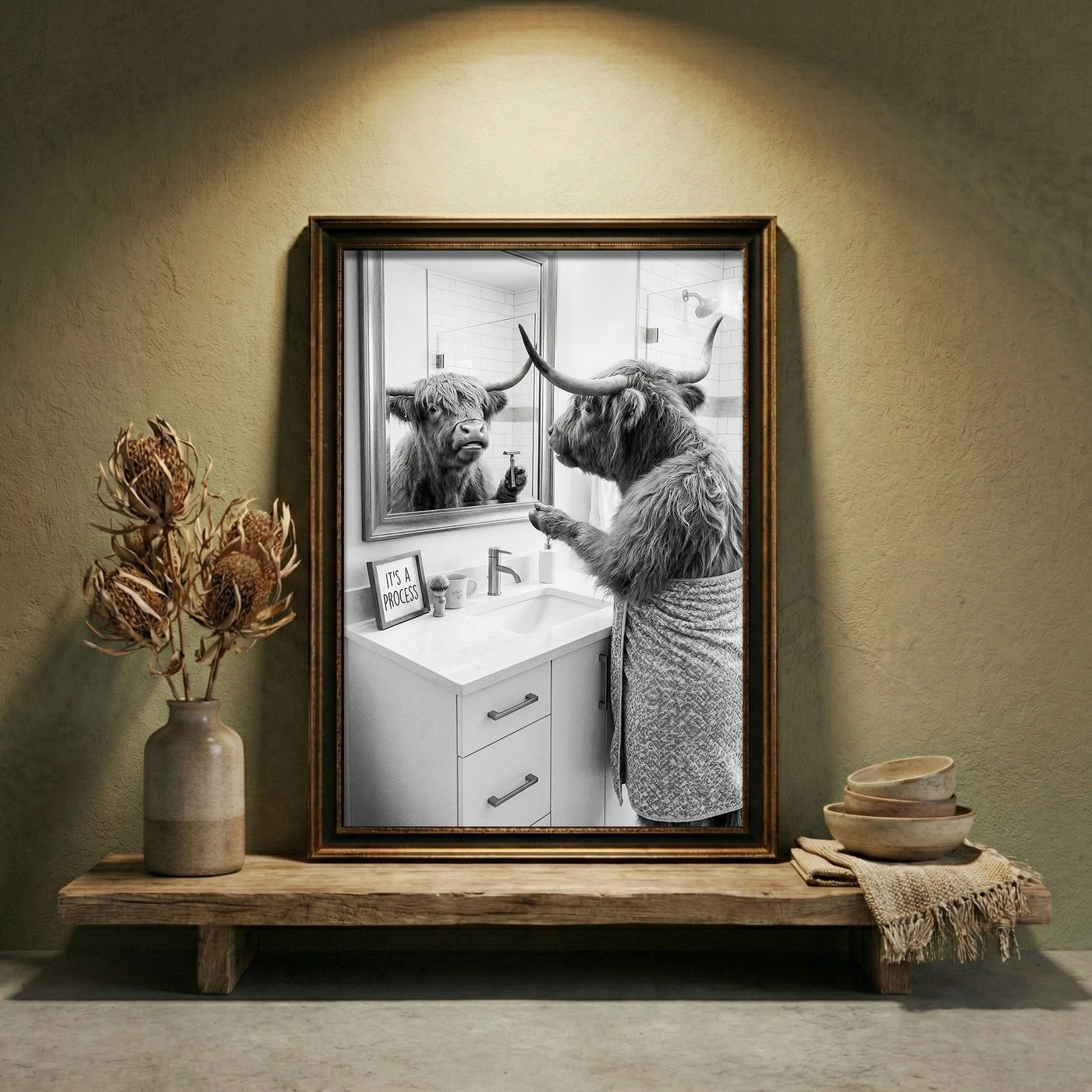 A crisp black and white photograph of a Highland cow looking in a bathroom mirror and holding a razor, with a small sign that says IT'S A PROCESS, created by Artazyn.