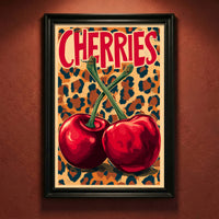 Retro pop art print featuring two large red cherries with green stems crossing against a leopard print background, with the word "CHERRIES" in bold red text.